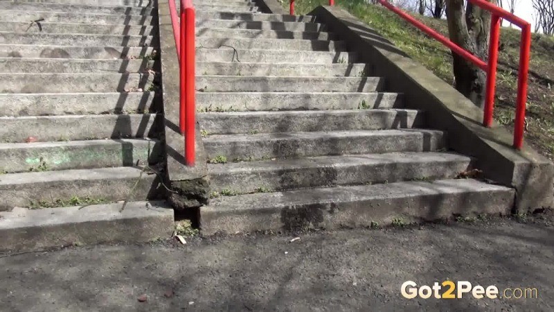 Dark haired girl pisses on concrete steps #67499790