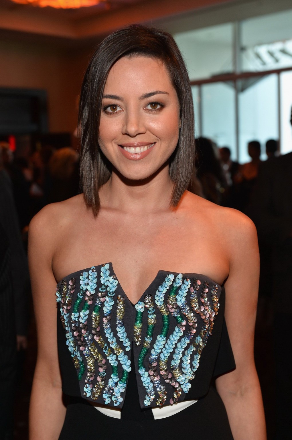 Aubrey Plaza braless wearing short strapless dress during 28th Annual Imagen Awa #75221227