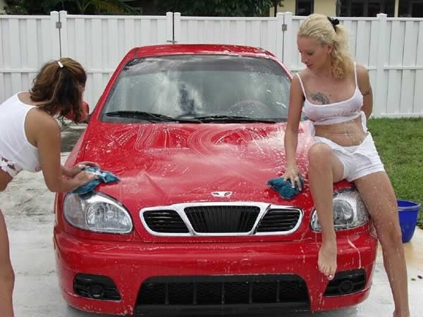 Two amateur girls playing and washing a car #74098105