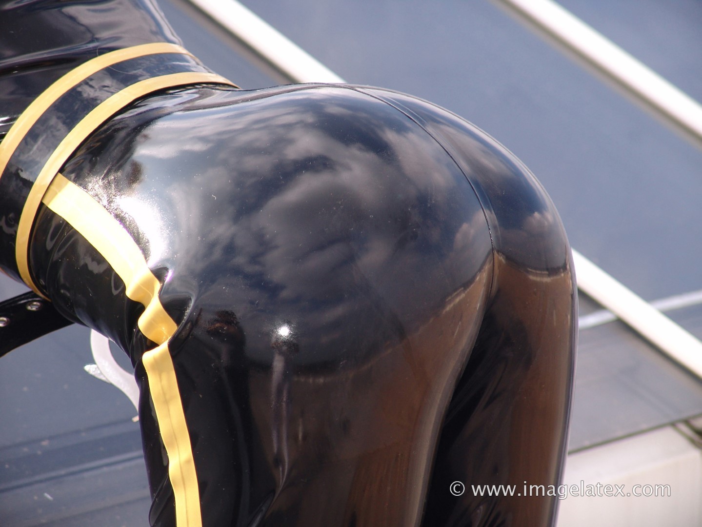 Pretty blonde Natalie poses up on the roof in a latex police cat #75731872