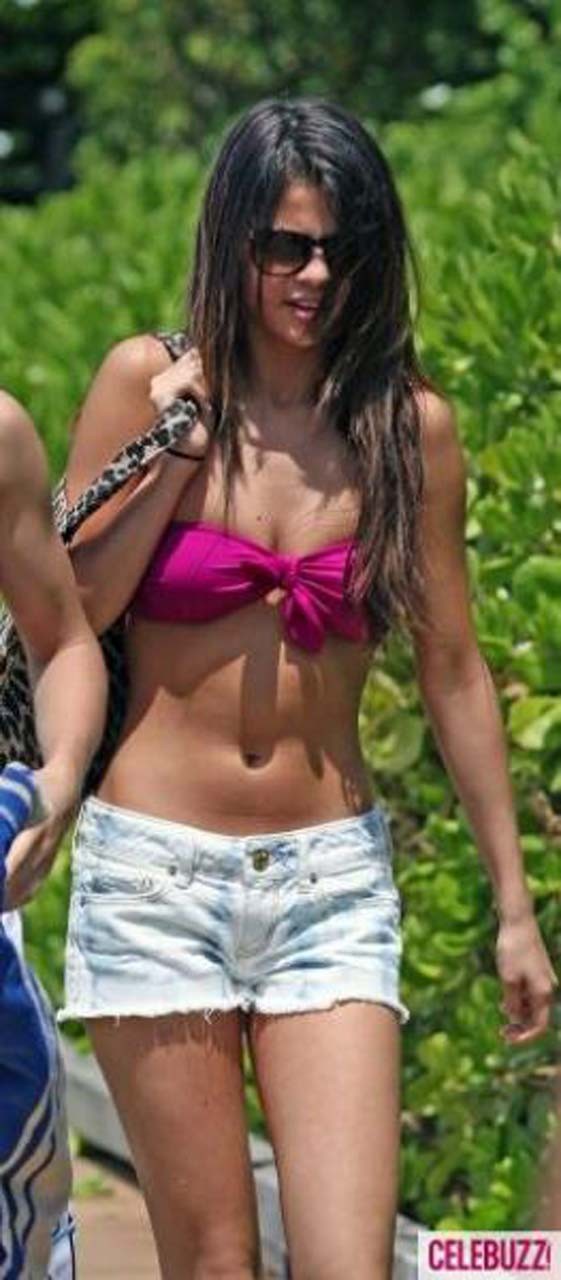 Selena Gomez exposing sexy body in bikini while walking with her boyfriend #75303282