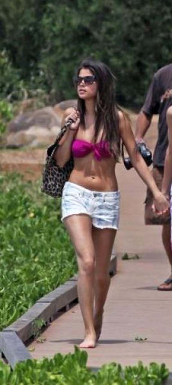 Selena Gomez exposing sexy body in bikini while walking with her boyfriend #75303289