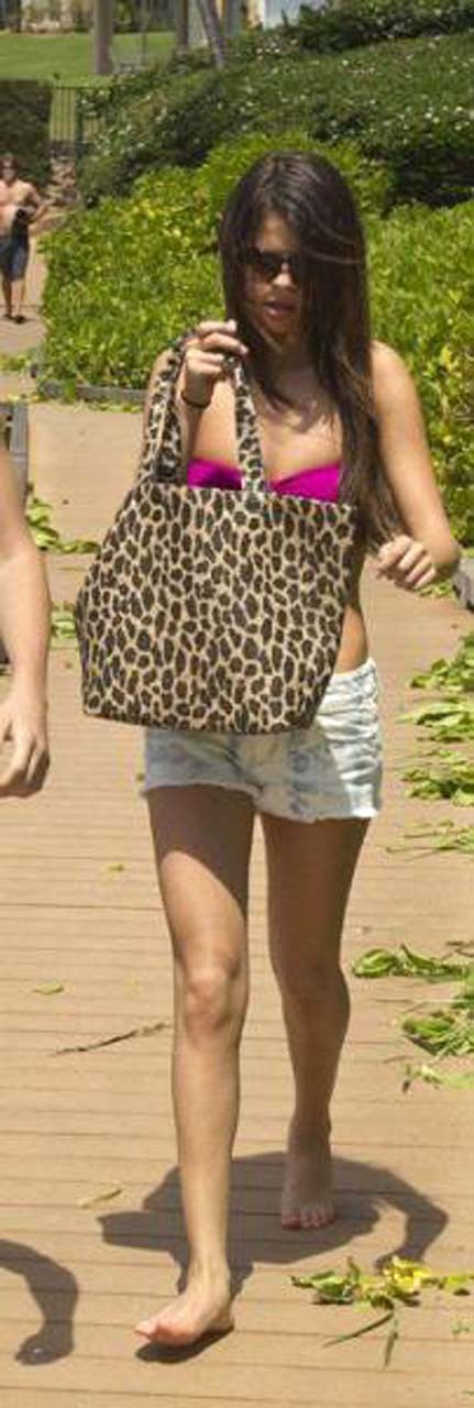 Selena Gomez exposing sexy body in bikini while walking with her boyfriend #75303309