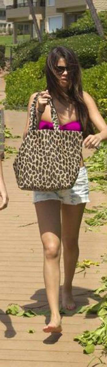 Selena Gomez exposing sexy body in bikini while walking with her boyfriend #75303319