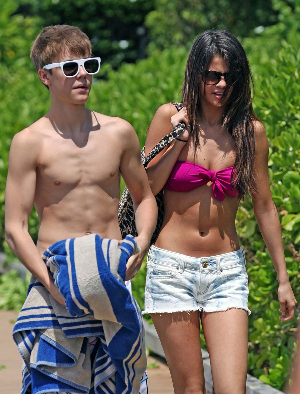 Selena Gomez exposing sexy body in bikini while walking with her boyfriend #75303343