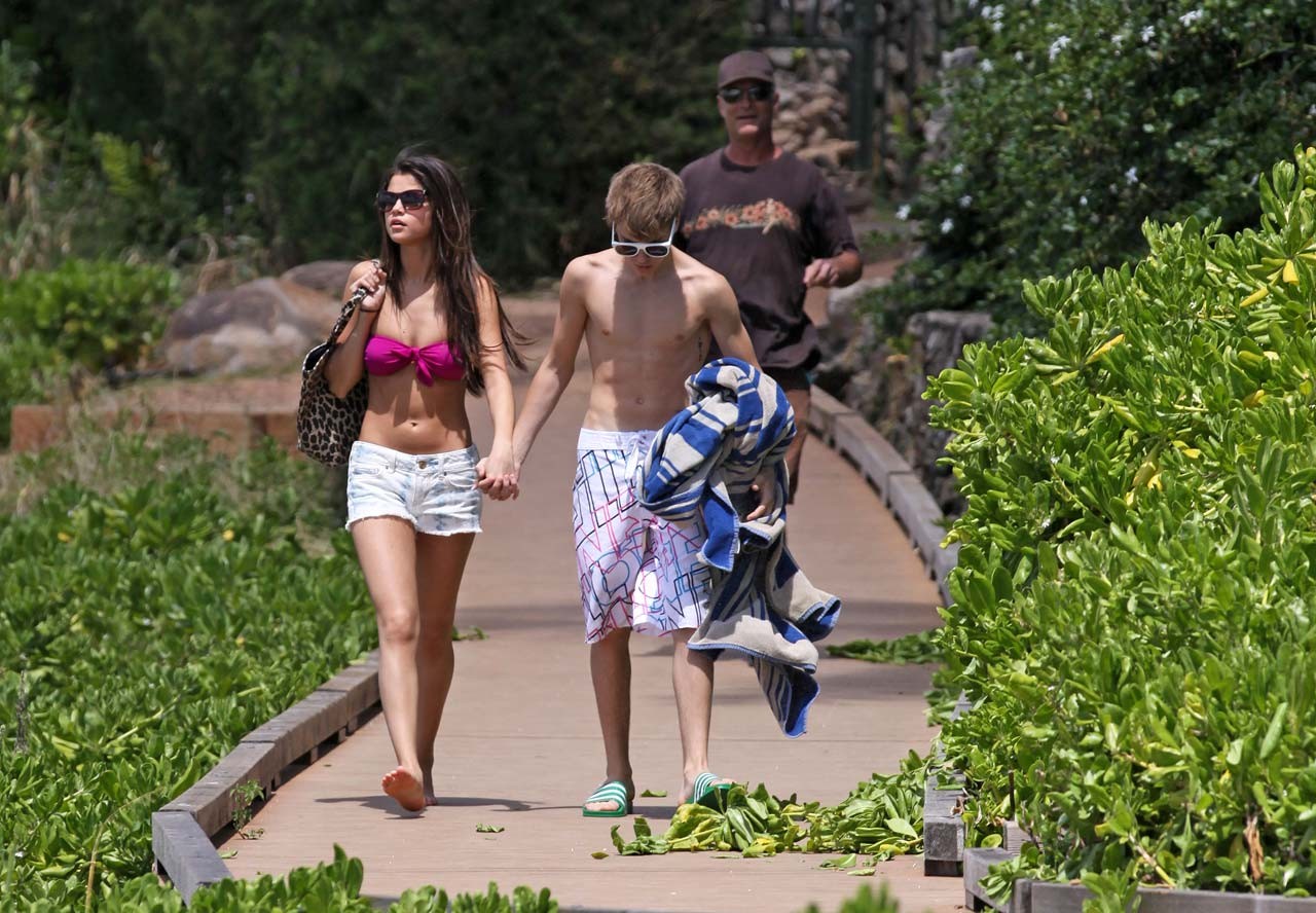 Selena Gomez exposing sexy body in bikini while walking with her boyfriend #75303356