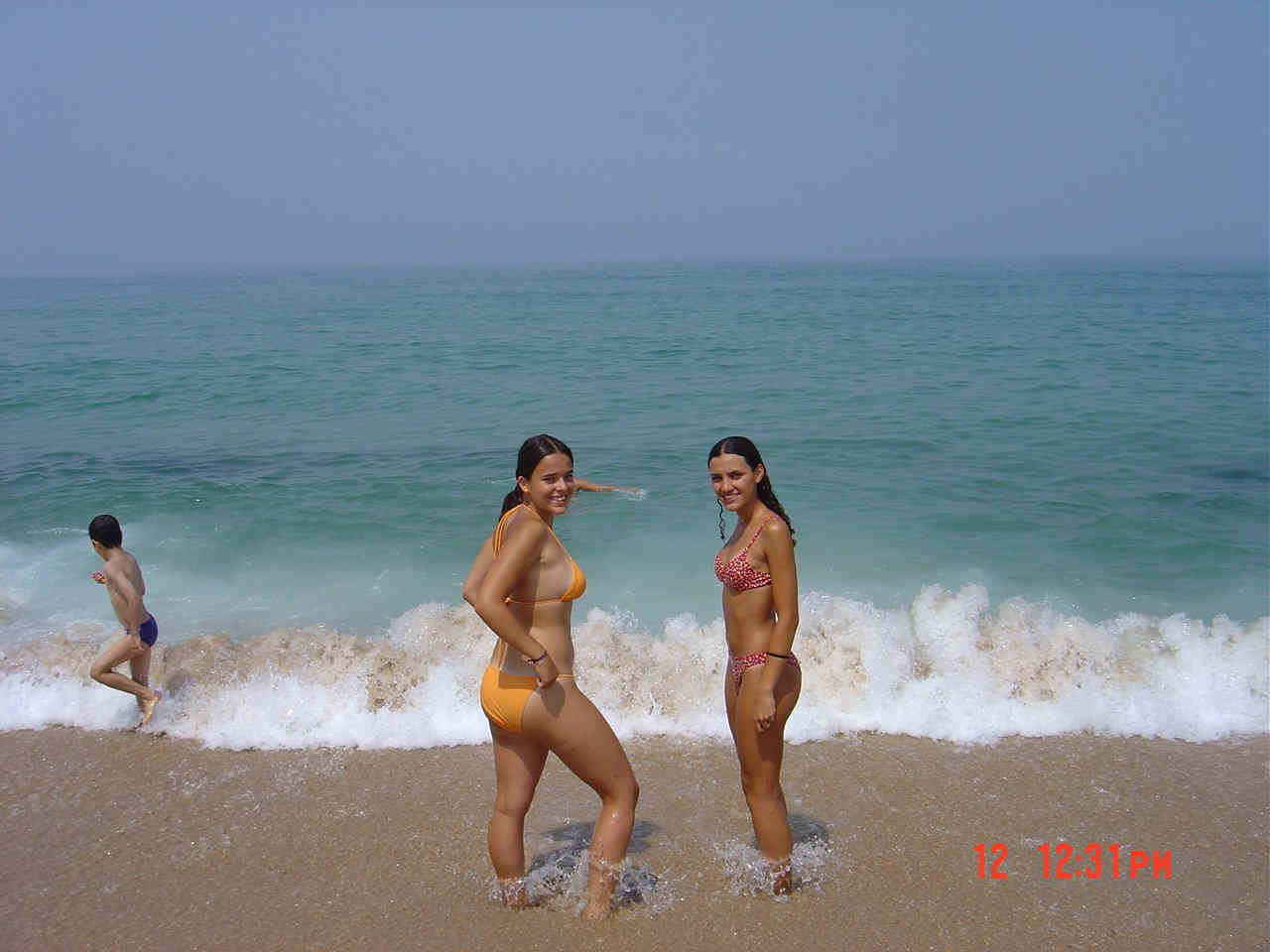 Teens topless on the beach #72321047