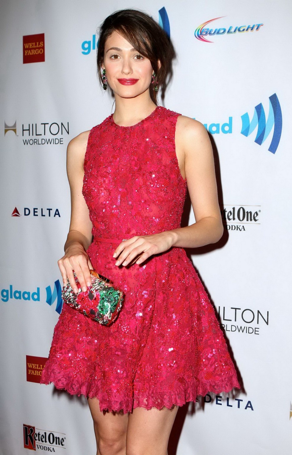 Emmy rossum luciendo piernas con un mini vestido de encaje rojo ligeramente transparente en nyc
 #75197358