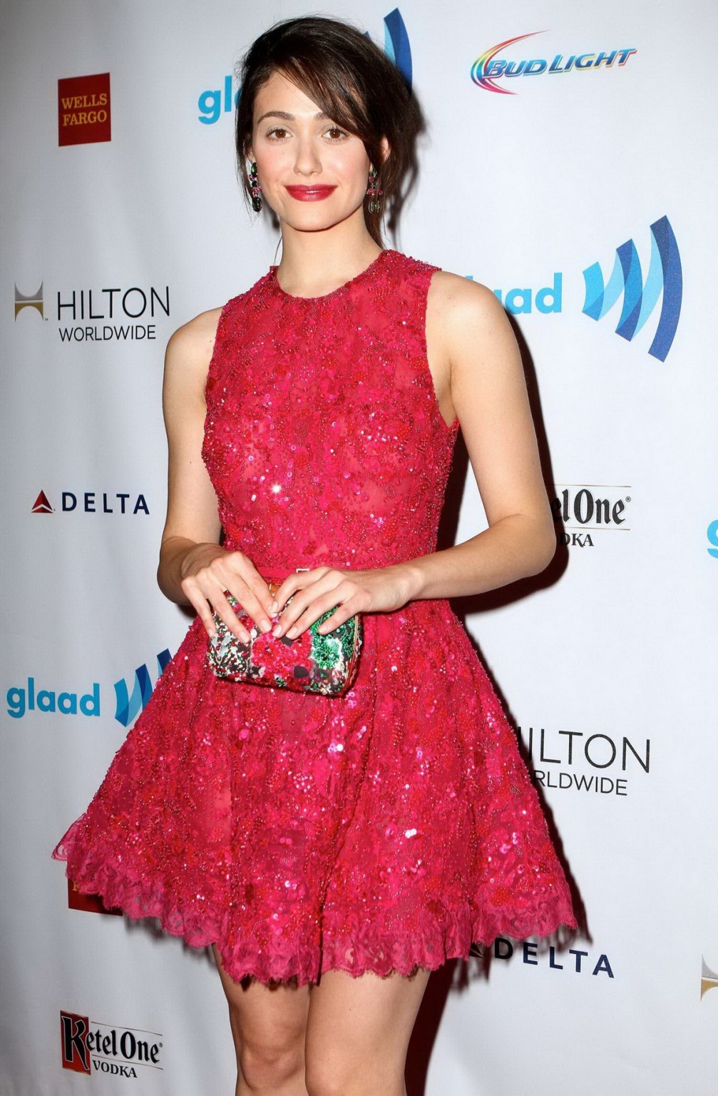 Emmy rossum luciendo piernas con un mini vestido de encaje rojo ligeramente transparente en nyc
 #75197366