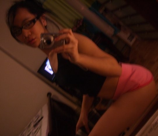 Cute Asian teen with glasses taking selfpics #69962521