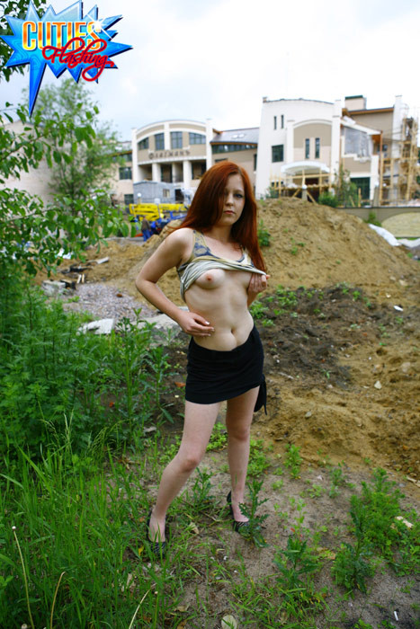 Loose redhead gets naked at a construction site #70402608