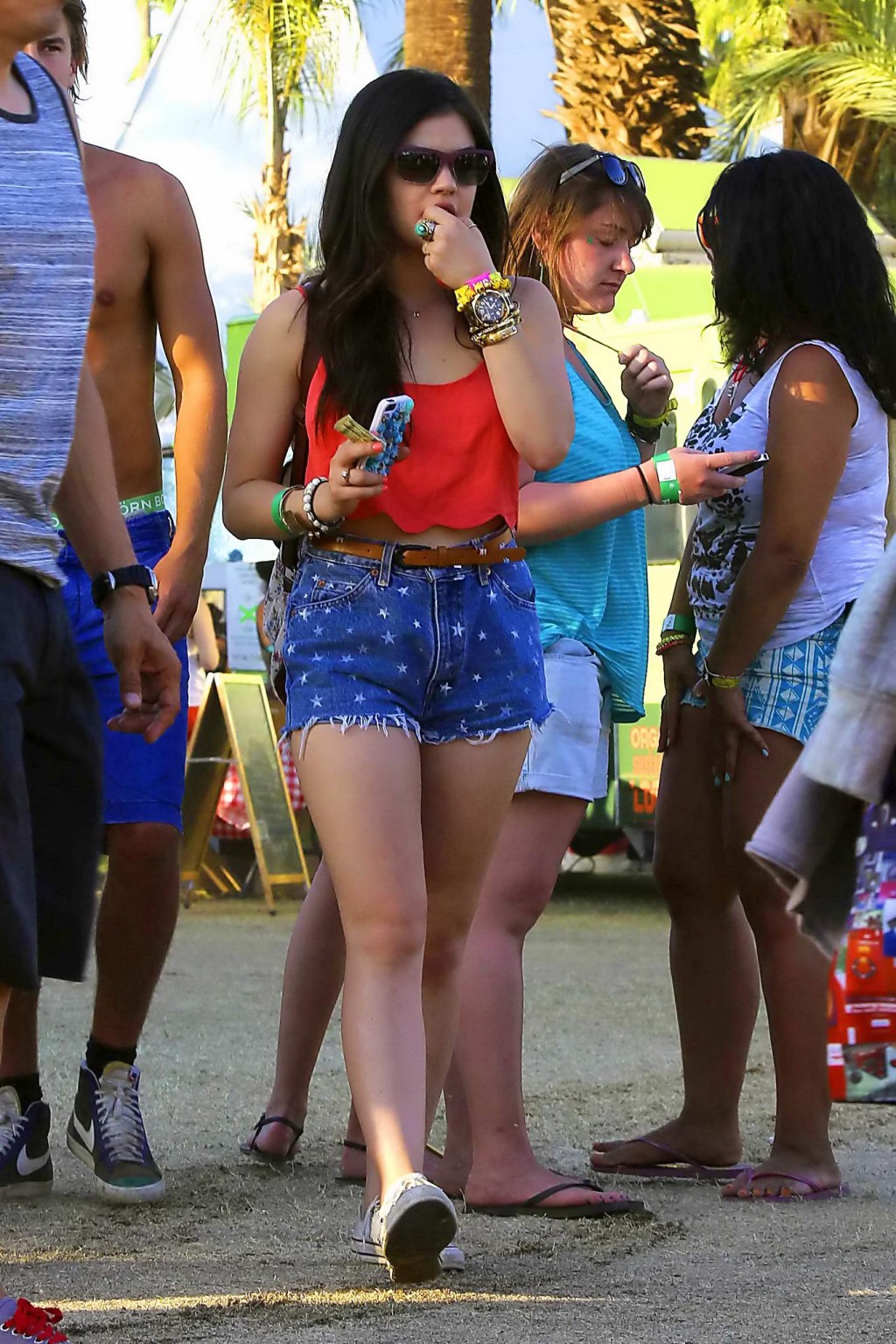 Lucy Hale wearing tiny red belly top and denim shorts at 2013 Coachella Music an #75234746