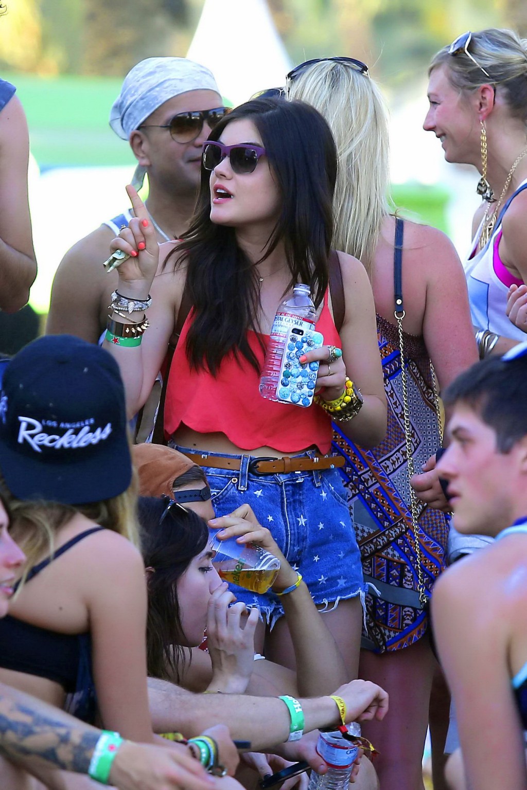 Lucy Hale wearing tiny red belly top and denim shorts at 2013 Coachella Music an #75234756
