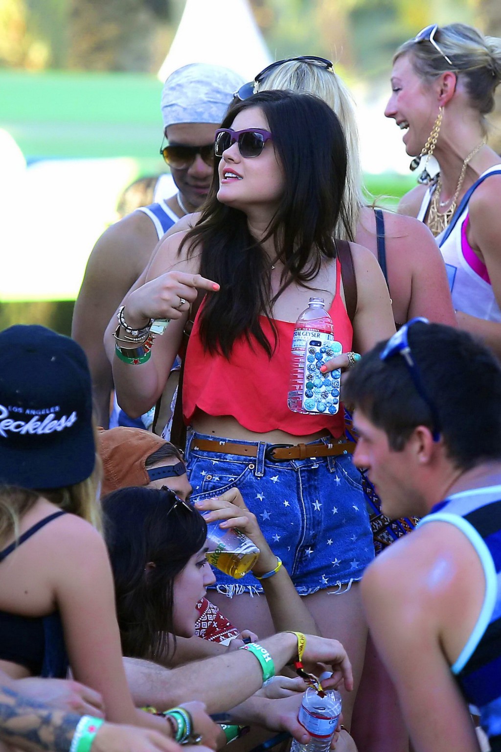Lucy Hale wearing tiny red belly top and denim shorts at 2013 Coachella Music an #75234764