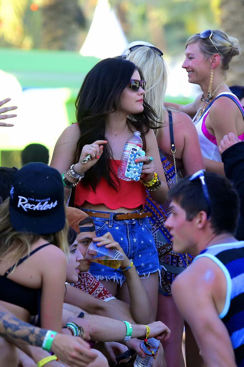 Lucy Hale wearing tiny red belly top and denim shorts at 2013 Coachella Music an #75234780