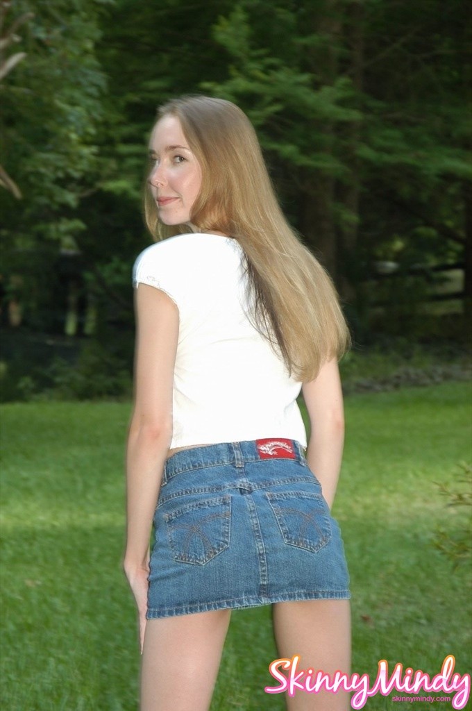 Skinny teen girl teasing outdoors #78610893