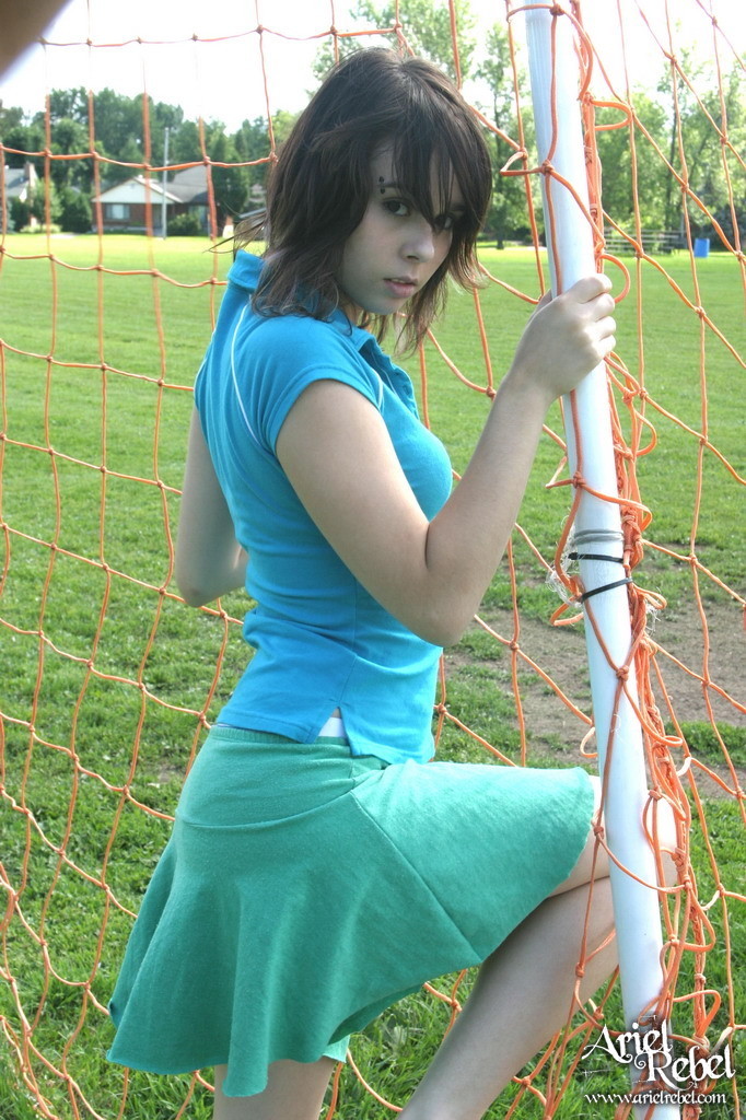 Sporty teen girl in skirt outside #67553676