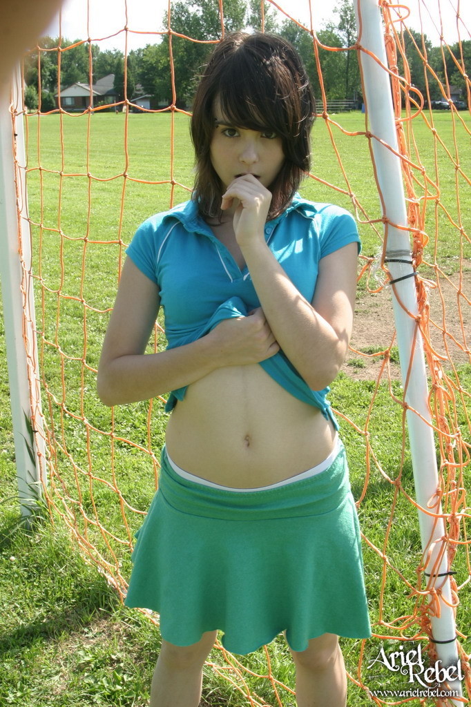 Sporty teen girl in skirt outside #67553683
