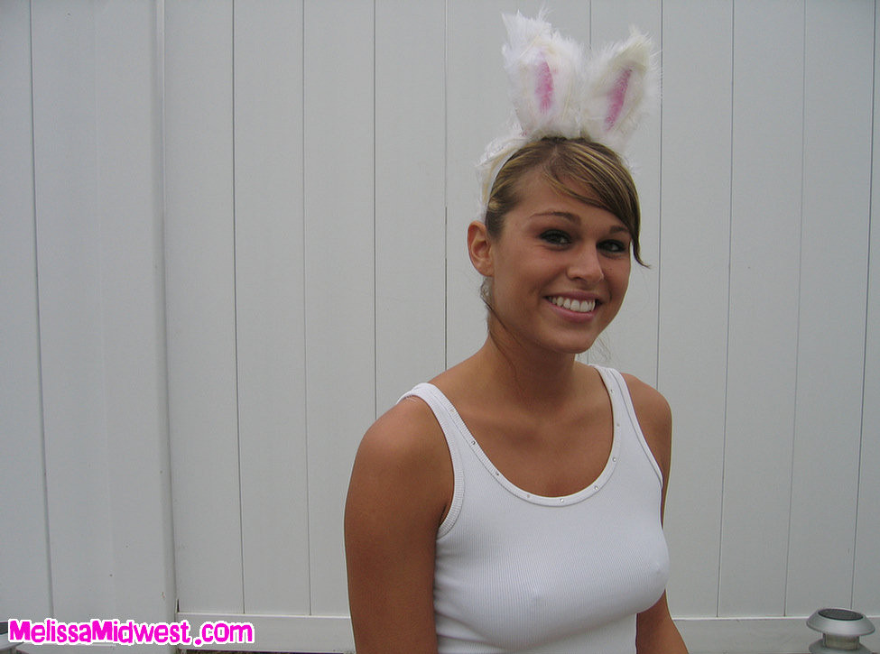Melissa Midwest dressed up like a bunny finding Easter eggs
