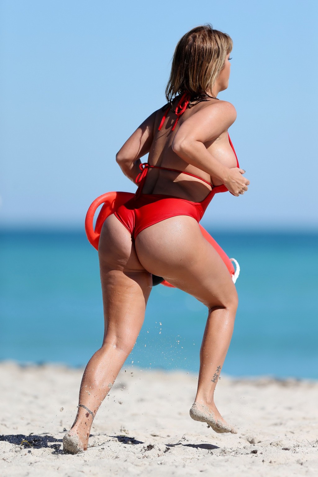 Jolena Forde wearing tiny red monokini while filming Baywatch in Miami Beach #75205743