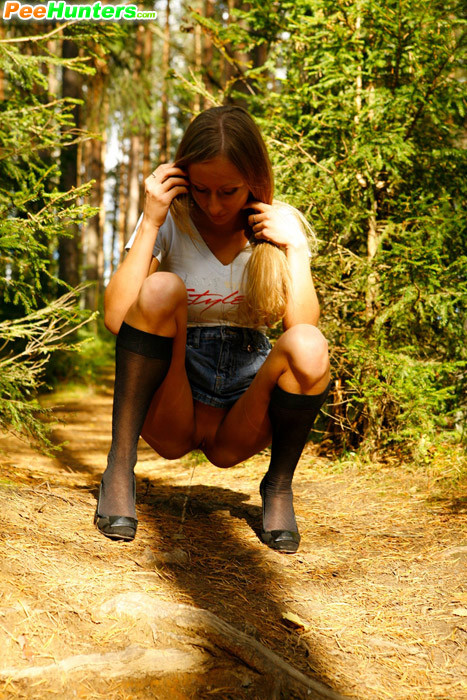 Blonde puss with gorgeous body pees on forest path #78692702