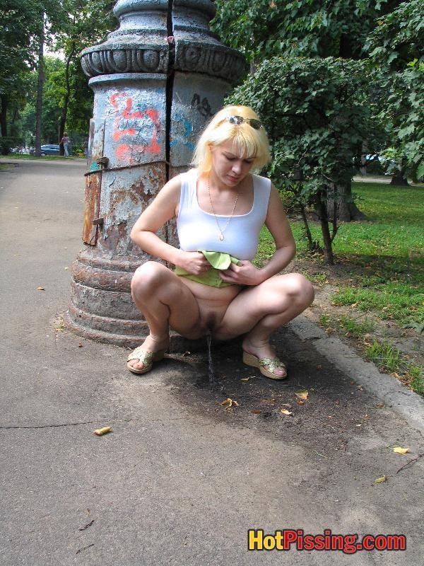 Outdoor pissing escapade of a slutress in a white top and a green mini #76521236