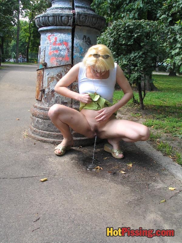 Outdoor pissing escapade of a slutress in a white top and a green mini #76521251