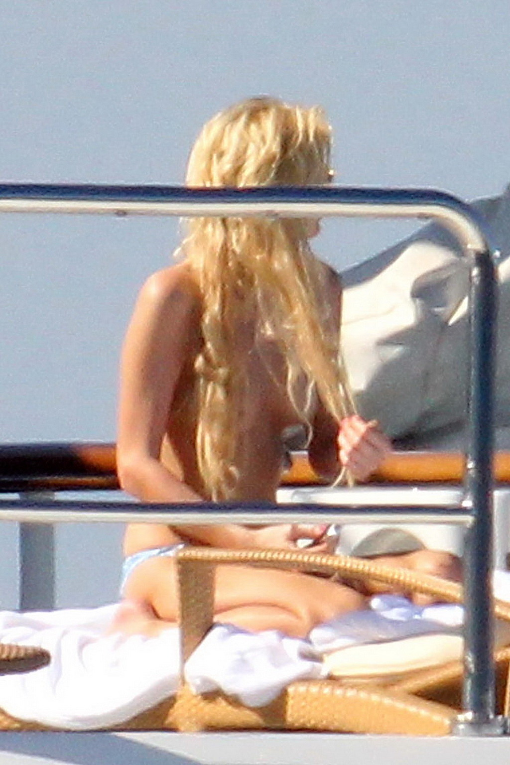 Paris Hilton topless showing off her small tits on a yacht in Italy #75340708