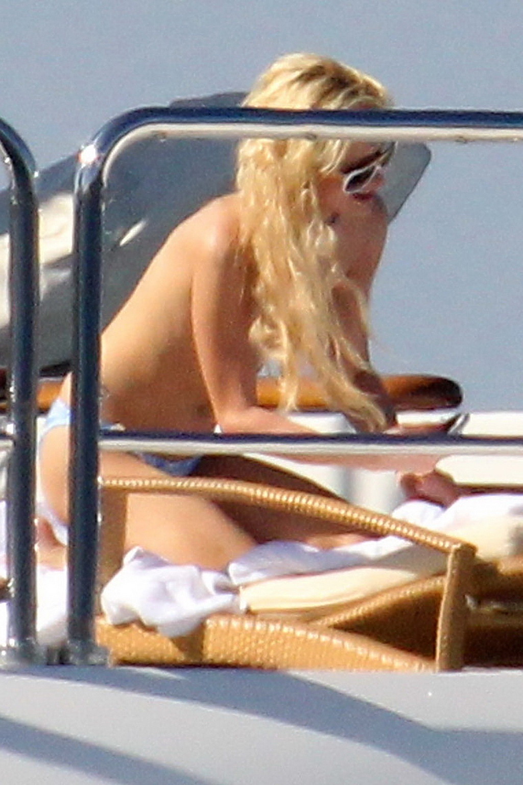 Paris Hilton topless showing off her small tits on a yacht in Italy #75340769