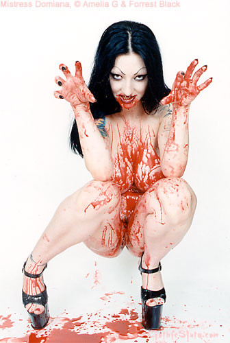 Tattooed vampire girl covers herself in blood #71005768