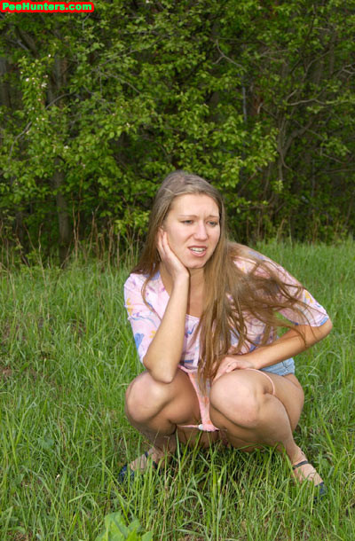 Longhair amateur blonde girl peeing outdoors #78617156