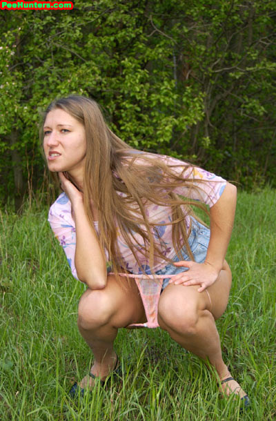 Longhair amateur blonde girl peeing outdoors #78617161
