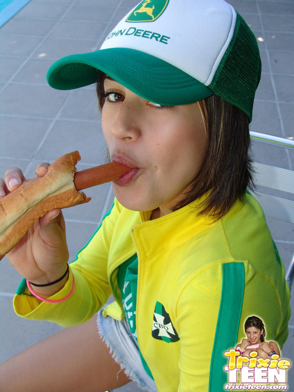 Hot trixie in baseball uniform eating hotdog #67752942