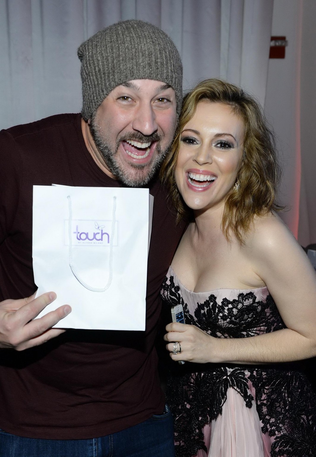 Busty Alyssa Milano wearing a strapless dress at the Maxim Big Game Weekend in N #75205904