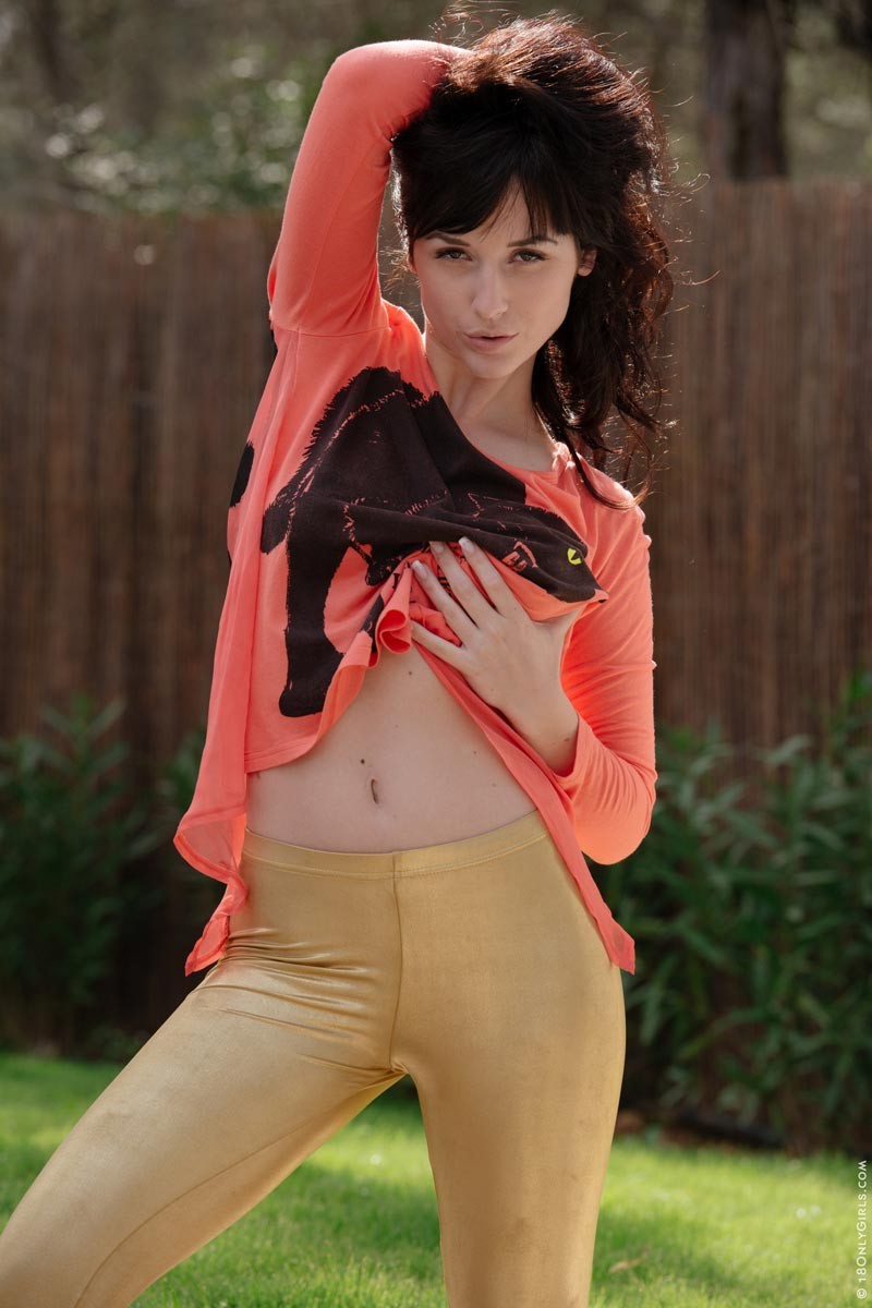 Busty brunette strips in the backyard