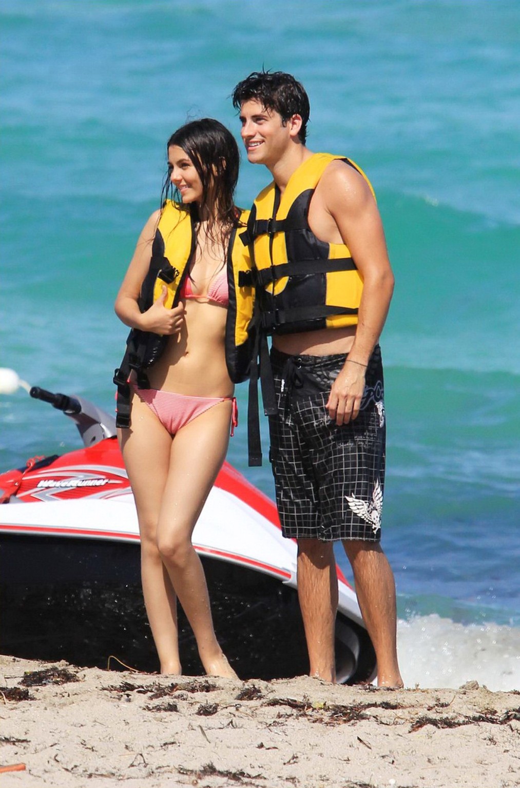 Victoria Justice shows cameltoe wearing wet bikini on a beach in Florida #75289743