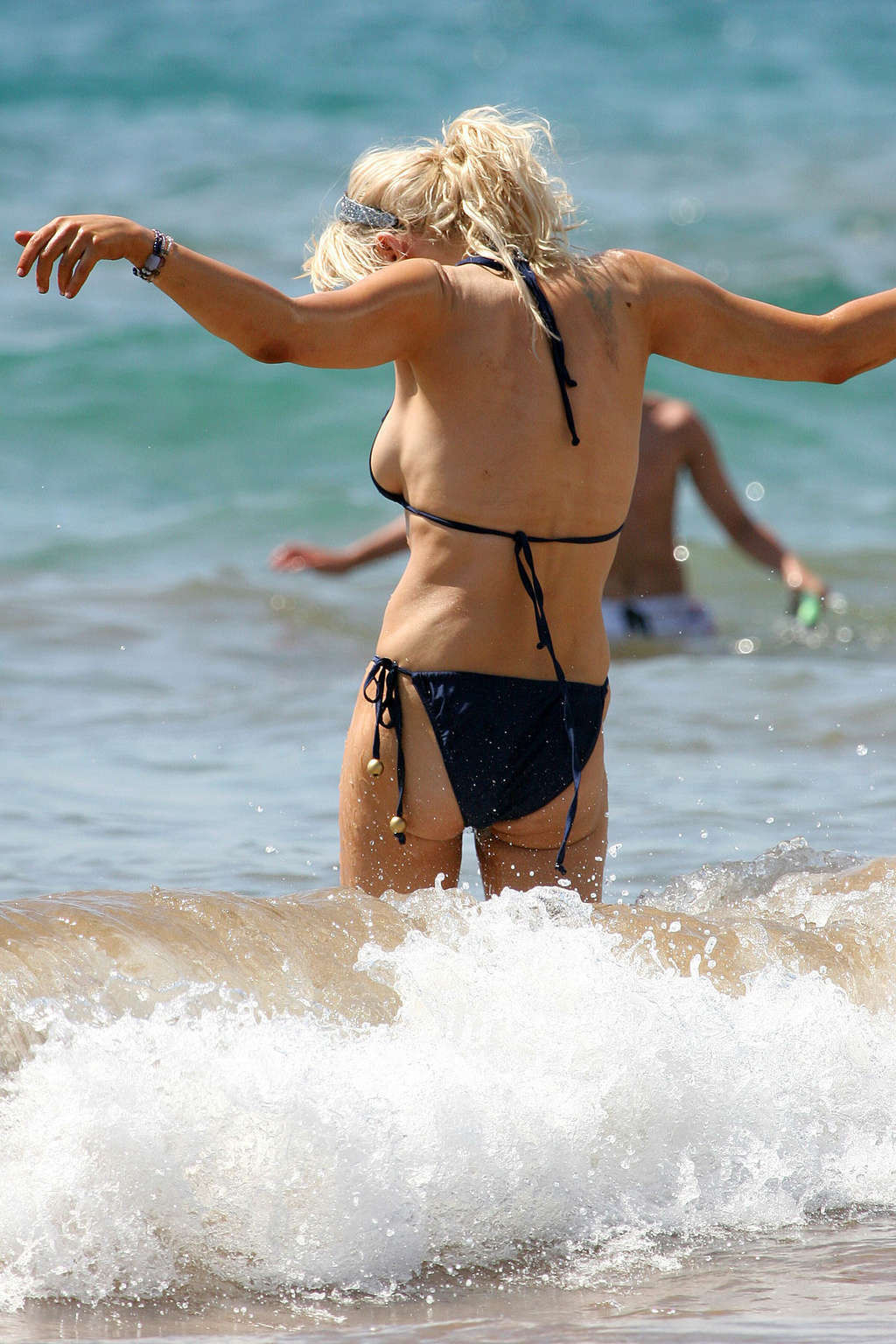 Courtney Love posing on the beach in black bikini and showing sexy body #75375466