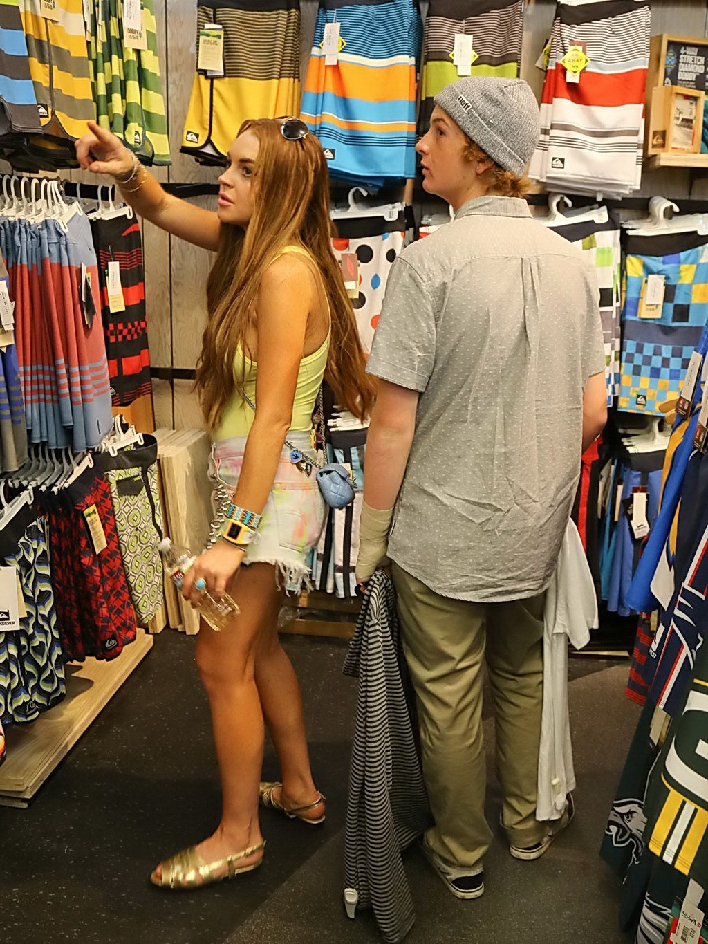 Lindsay Lohan braless in tiny yellow top and painted denim shorts at Jack's Surf #75254766
