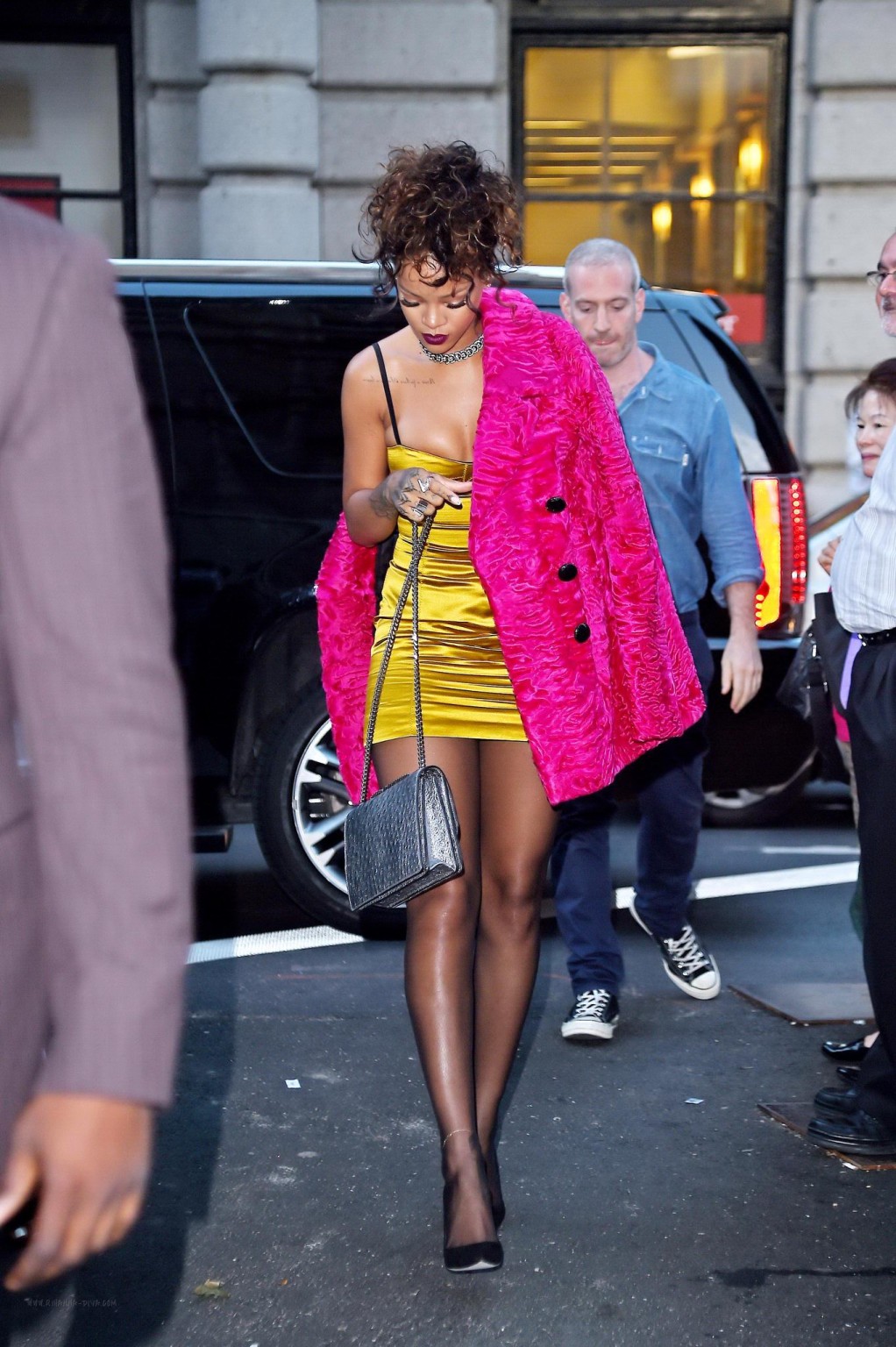 Rihanna shows cleavage and legs wearing a little yellow dress outside Nobu resta #75183294