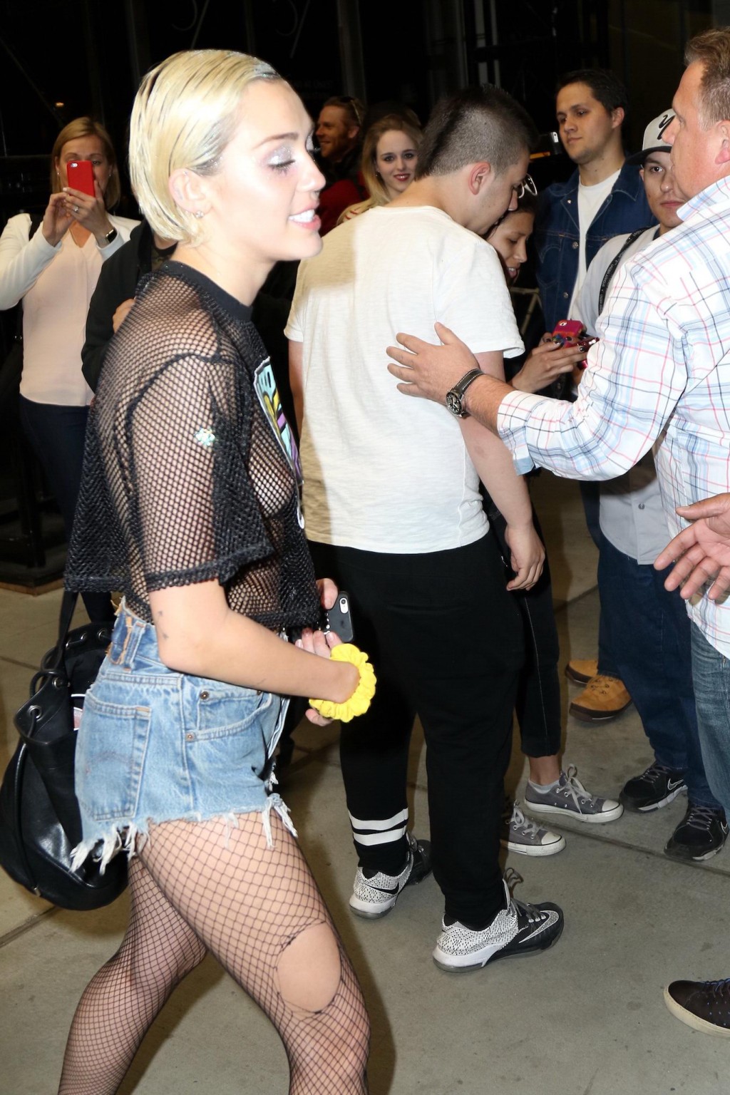 Miley Cyrus shows off her boobs wearing a mesh Tshirt out in NYC #75164202