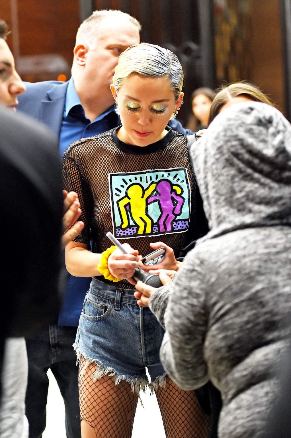 Miley Cyrus shows off her boobs wearing a mesh Tshirt out in NYC #75164243