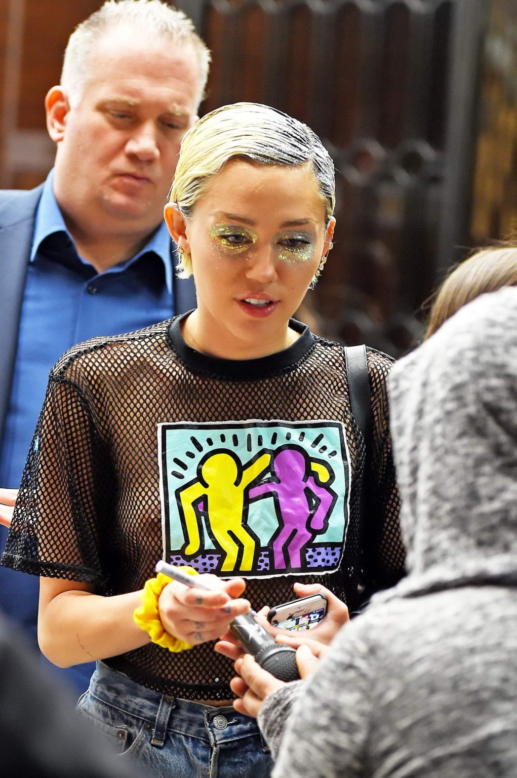 Miley Cyrus shows off her boobs wearing a mesh Tshirt out in NYC #75164253