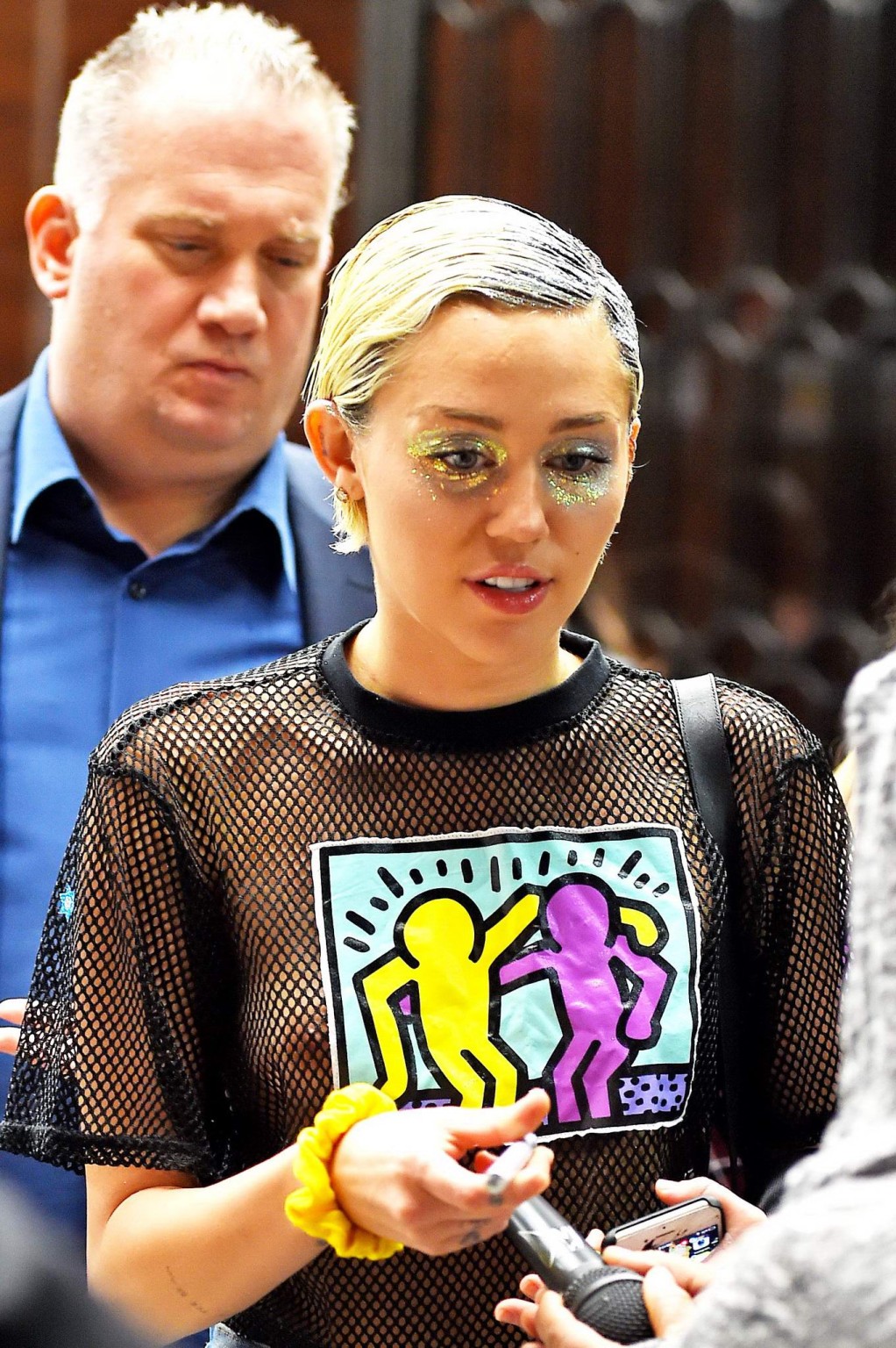 Miley Cyrus shows off her boobs wearing a mesh Tshirt out in NYC #75164259