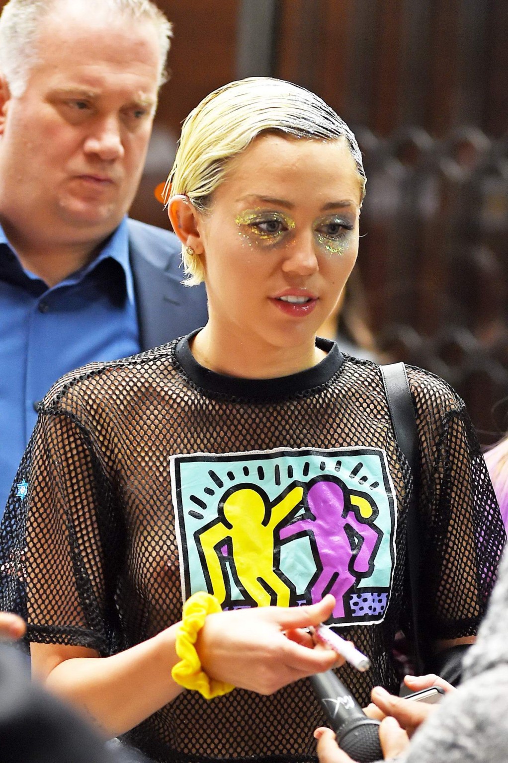 Miley Cyrus shows off her boobs wearing a mesh Tshirt out in NYC #75164271