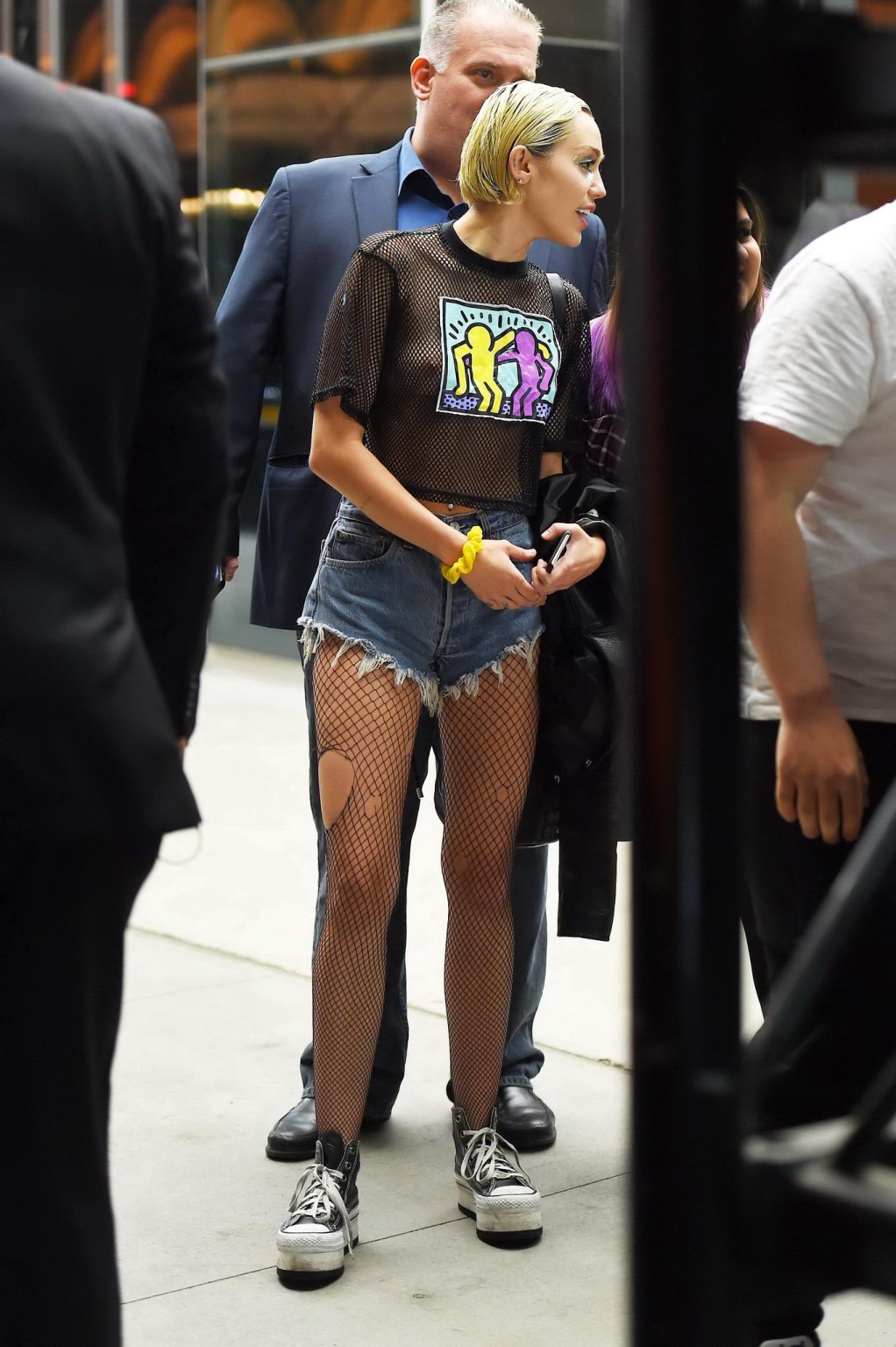 Miley Cyrus shows off her boobs wearing a mesh Tshirt out in NYC #75164277