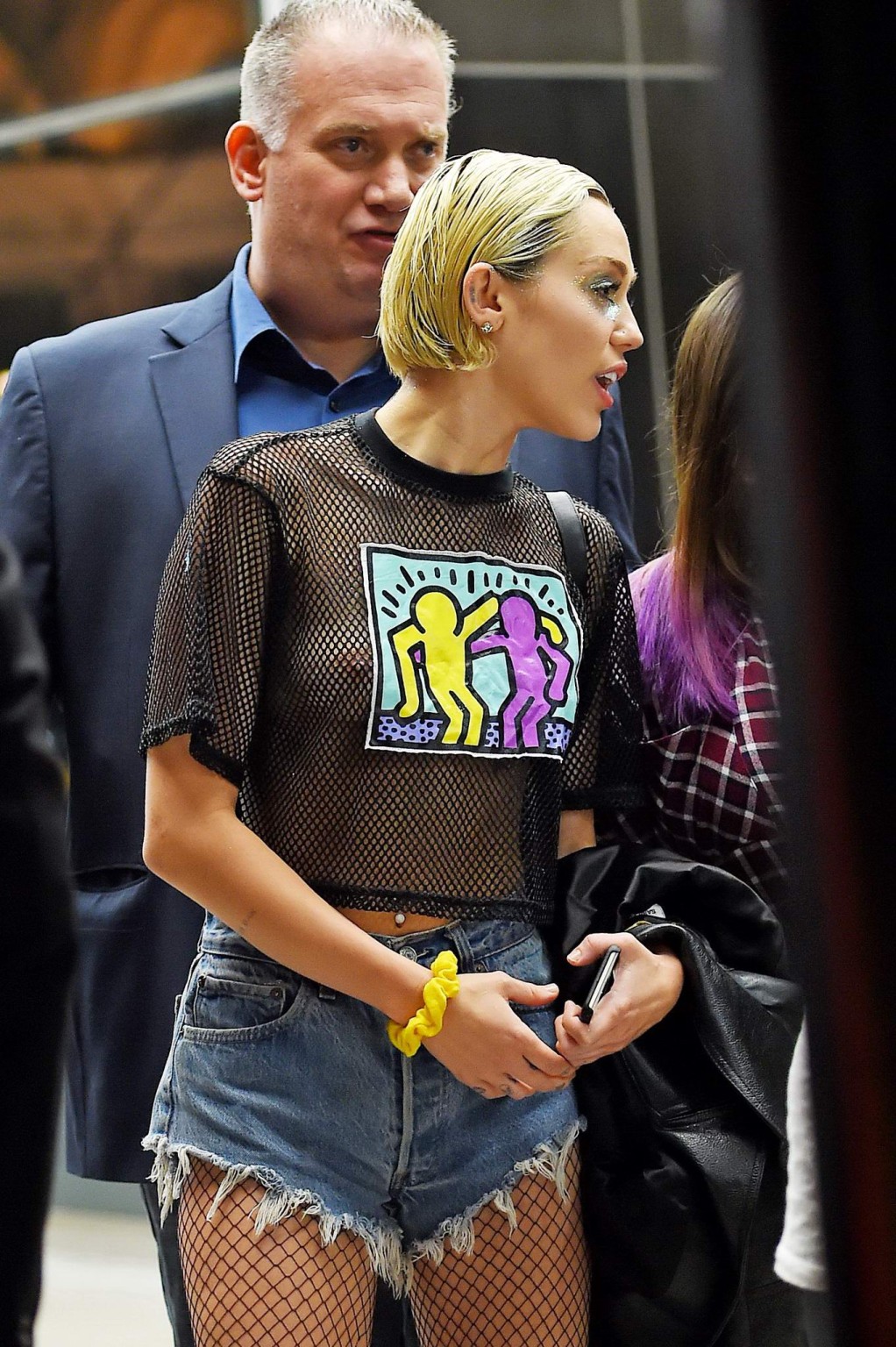 Miley Cyrus shows off her boobs wearing a mesh Tshirt out in NYC #75164282