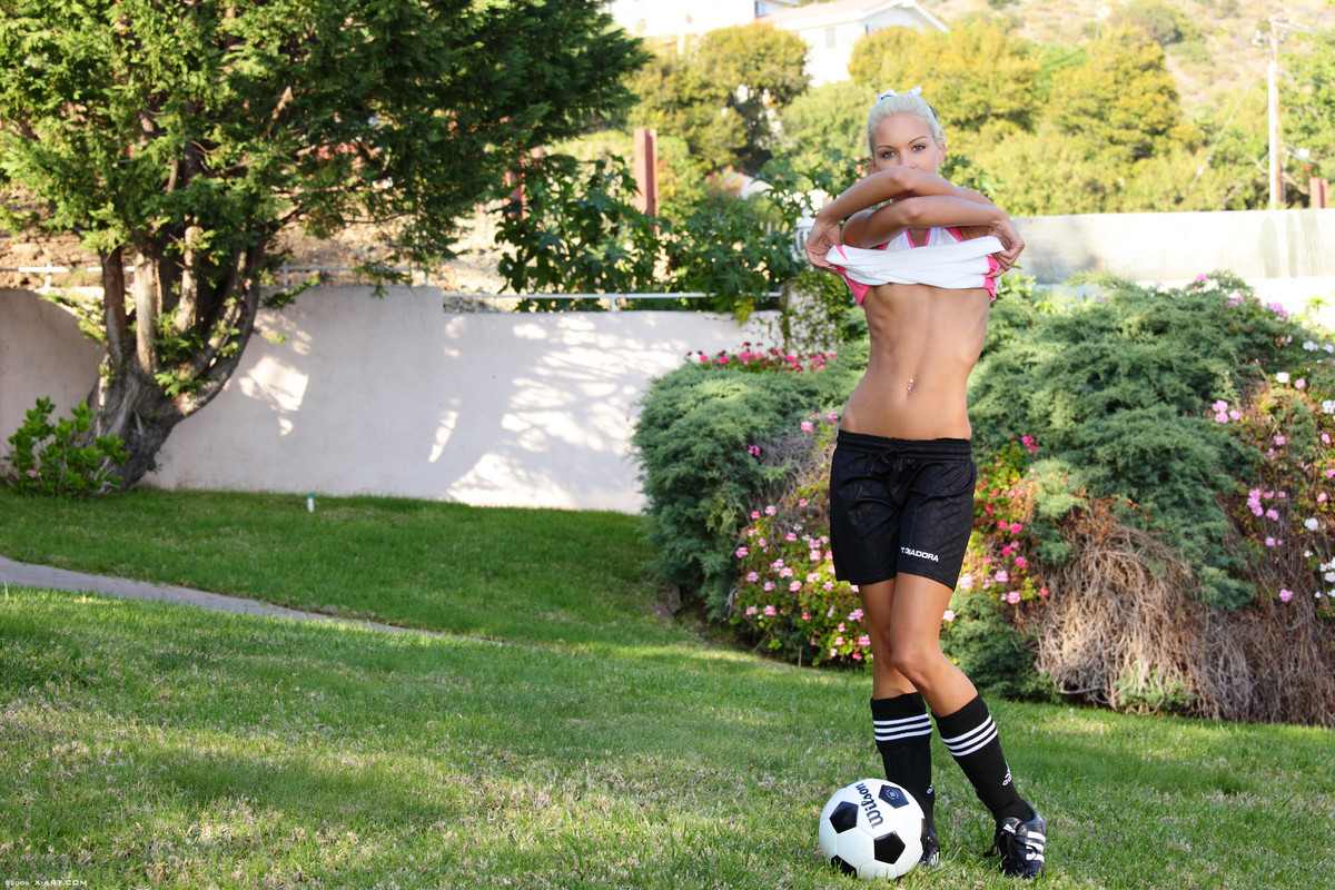 Thin teen blonde soccer girl outdoors #69735423