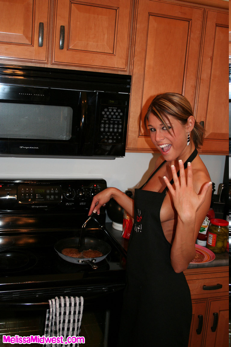 Melissa Midwest in the kitchen making hamburgers and hot dogs #67244678