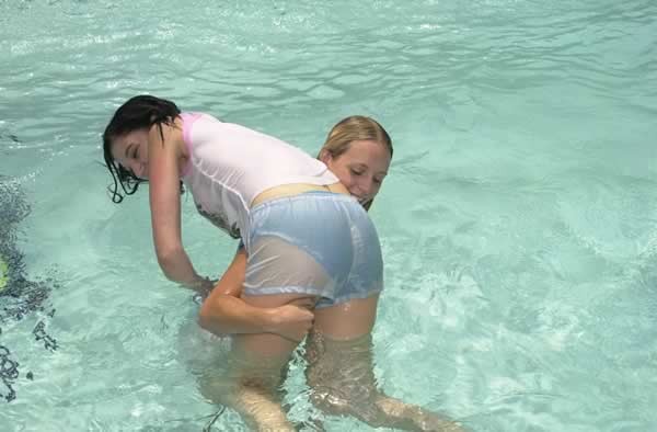 Cute lesbian in a swimming pool #74103701
