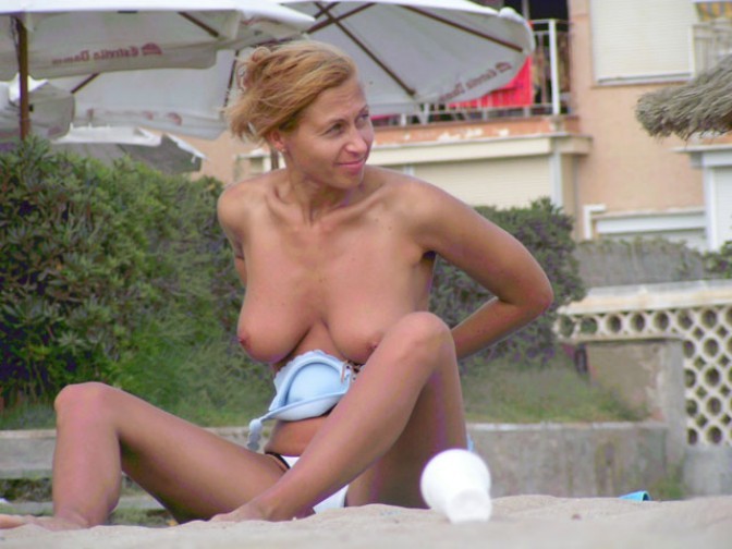 All eyes are on this attractive nudist as she sunbathes #72248279